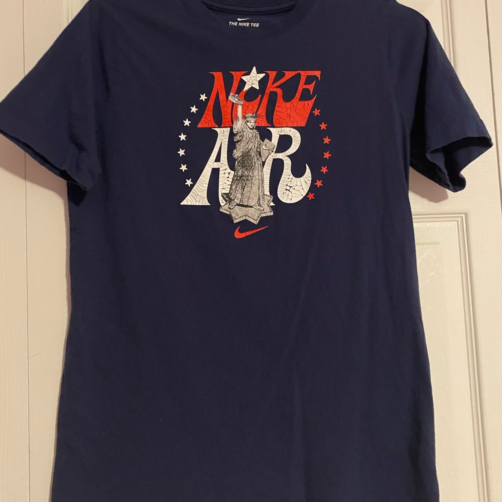 Navy and red Nike shirt boys